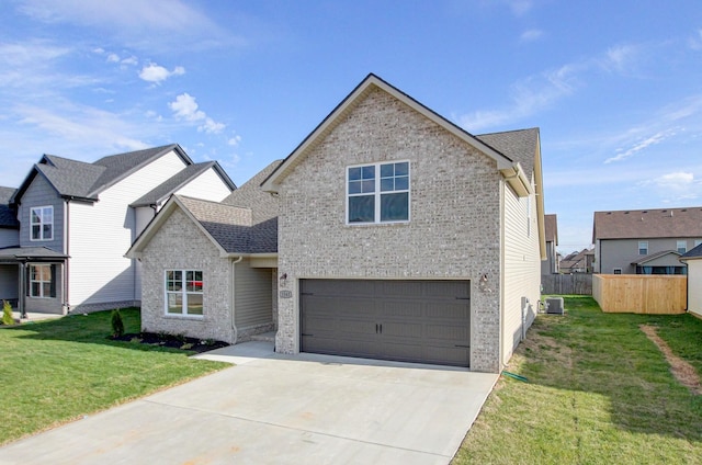 view of front of property featuring a garage, central air condition unit, and a front yard