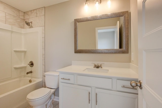 full bathroom with toilet, vanity, and tiled shower / bath