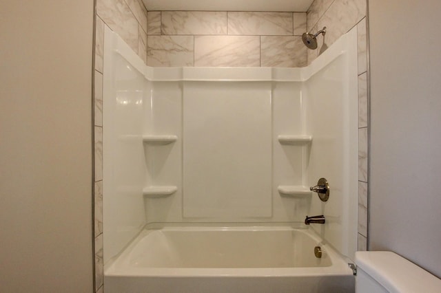 bathroom with shower / tub combination and toilet