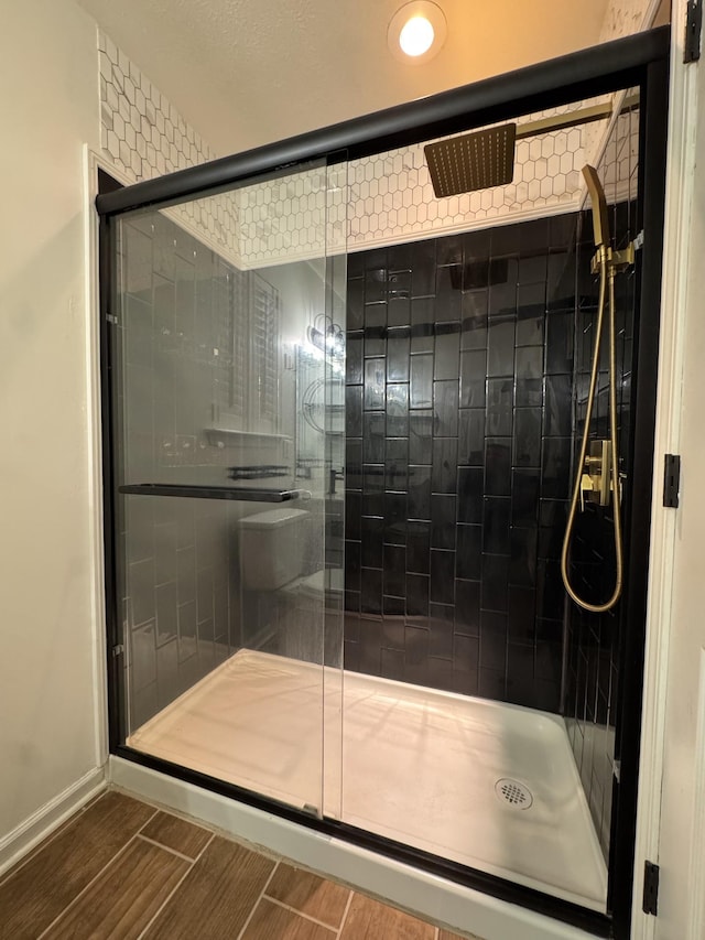 bathroom featuring an enclosed shower