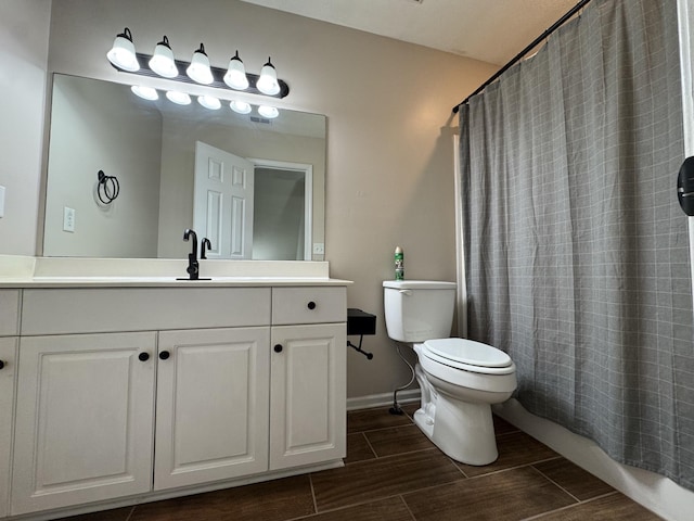 full bathroom with vanity, toilet, and shower / bath combo with shower curtain