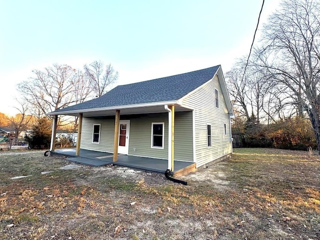 view of front of home featuring roof with shingles