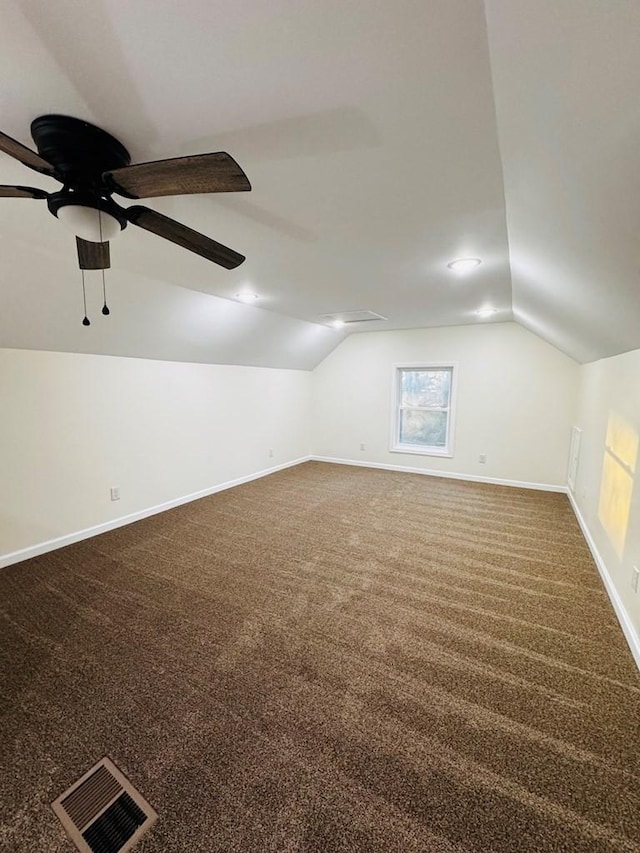 bonus room featuring carpet flooring, ceiling fan, and vaulted ceiling