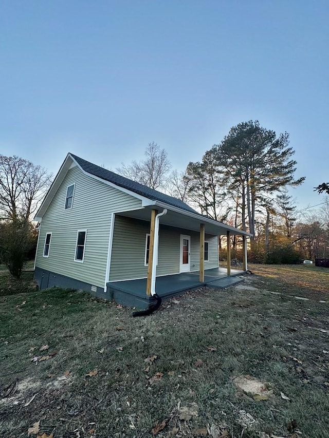 view of property exterior featuring a porch