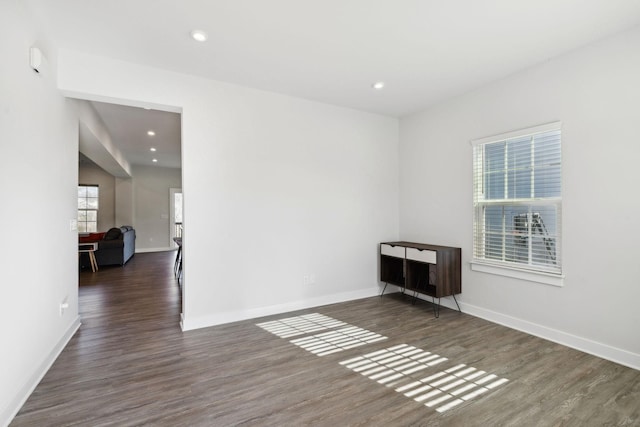 unfurnished room featuring dark hardwood / wood-style floors