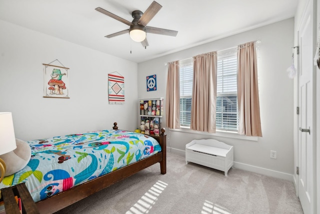 bedroom featuring ceiling fan and light carpet