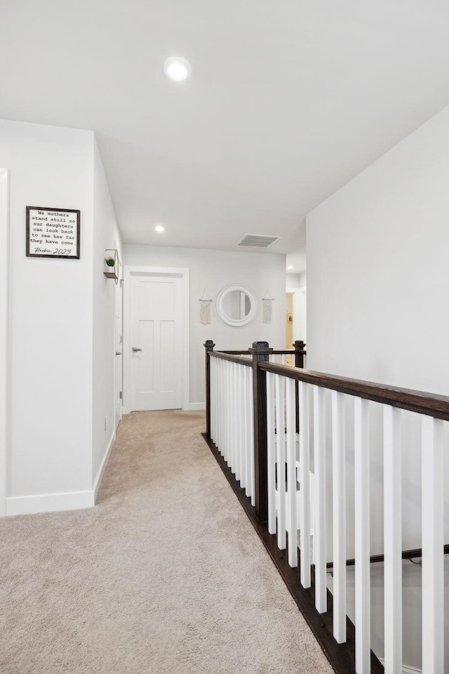 corridor with carpet floors