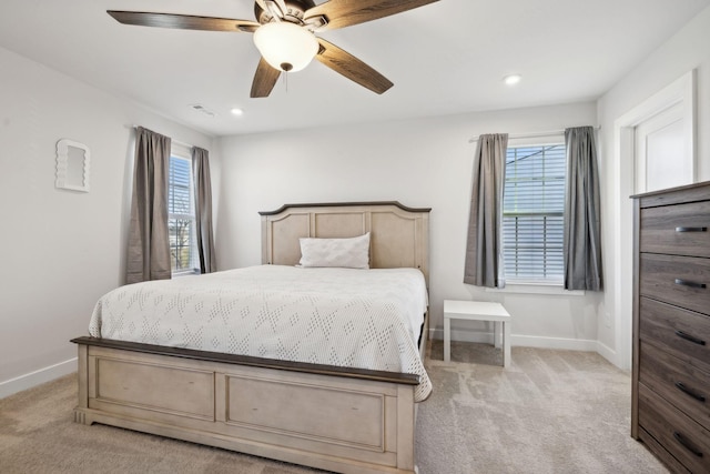 bedroom featuring ceiling fan and light colored carpet