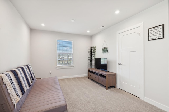 sitting room with light colored carpet