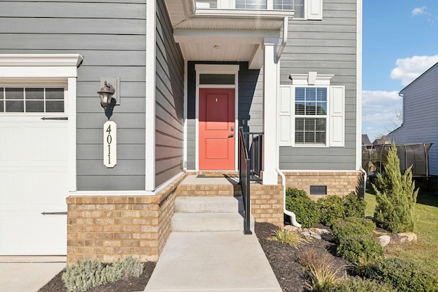 entrance to property featuring a garage