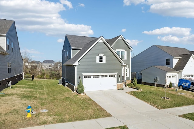 view of front property with a garage and a front lawn