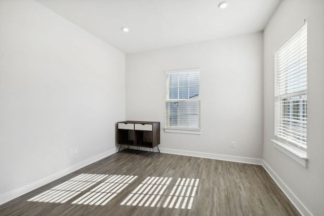 empty room featuring dark wood-type flooring