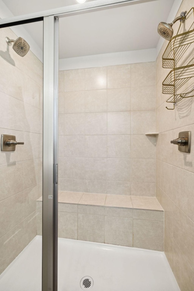 bathroom with a tile shower