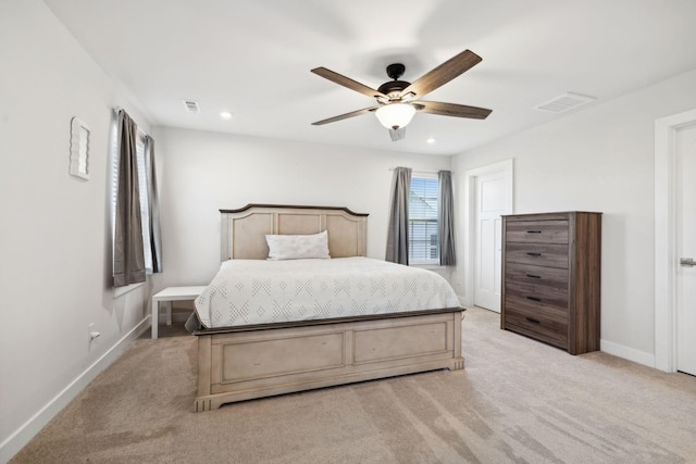 bedroom with ceiling fan and light colored carpet