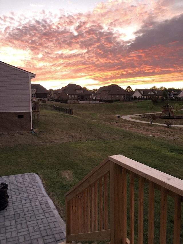 yard at dusk with a patio area