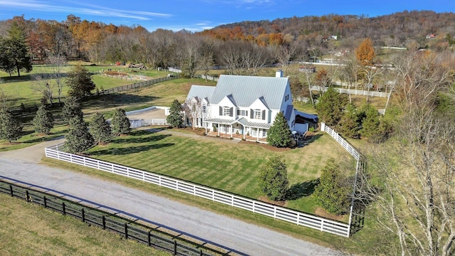 birds eye view of property with a rural view