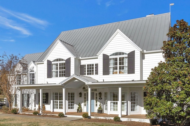 210 Green Rd, Franklin, TN 37069 - view of front of property with covered porch, a metal roof, and a standing seam roof