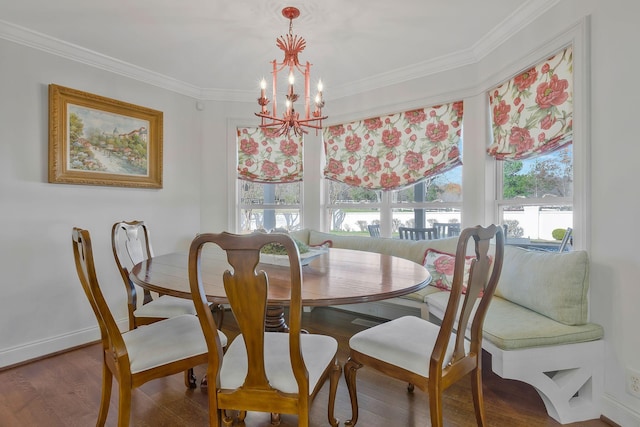 dining area with wood-type flooring, crown molding, and an inviting chandelier