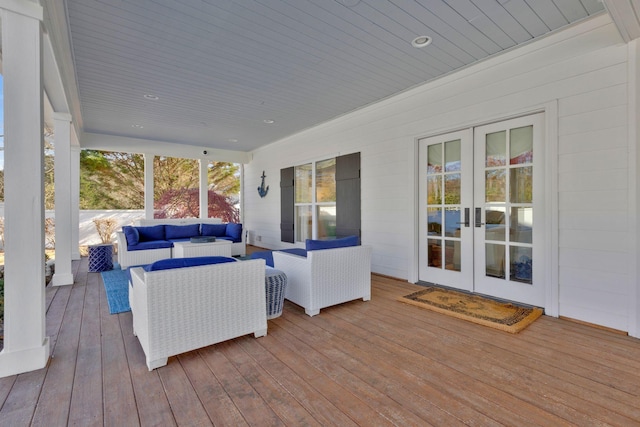 deck with an outdoor living space and french doors