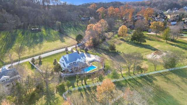 birds eye view of property with a rural view