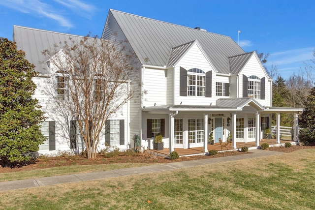 210 Green Rd, Franklin, TN 37069 - view of front of house featuring french doors, covered porch, a front yard, a standing seam roof, and a metal roof