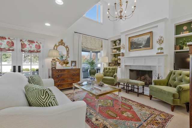 interior space with french doors, built in shelves, a chandelier, a high ceiling, and a tiled fireplace