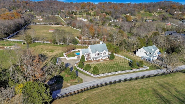 birds eye view of property with a rural view