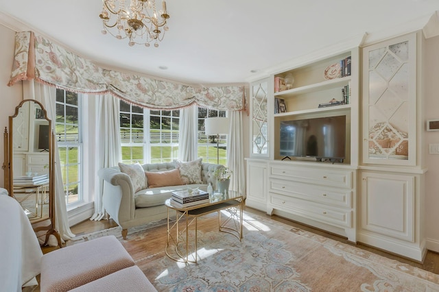 living room featuring light hardwood / wood-style floors and a notable chandelier