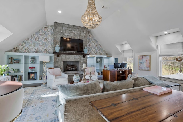 living room featuring a stone fireplace, a chandelier, and vaulted ceiling