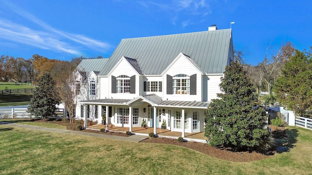 210 Green Rd, Franklin, TN 37069 - view of front of house with a standing seam roof, a metal roof, covered porch, and a chimney
