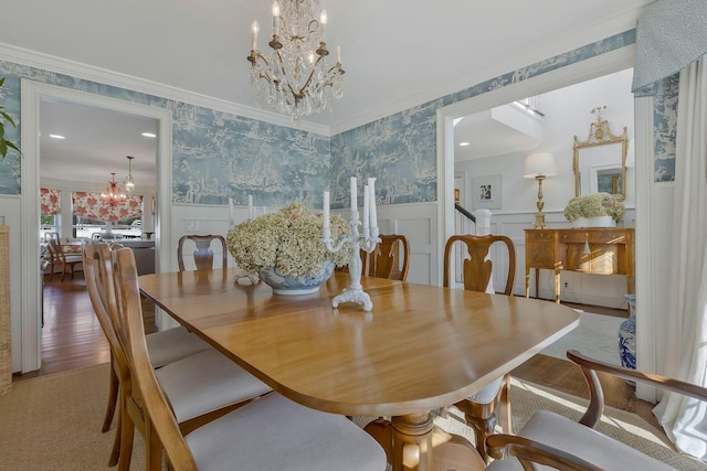210 Green Rd, Franklin, TN 37069 - dining room featuring wallpapered walls, a chandelier, a wainscoted wall, crown molding, and a decorative wall