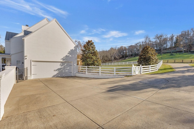 view of side of home featuring a garage