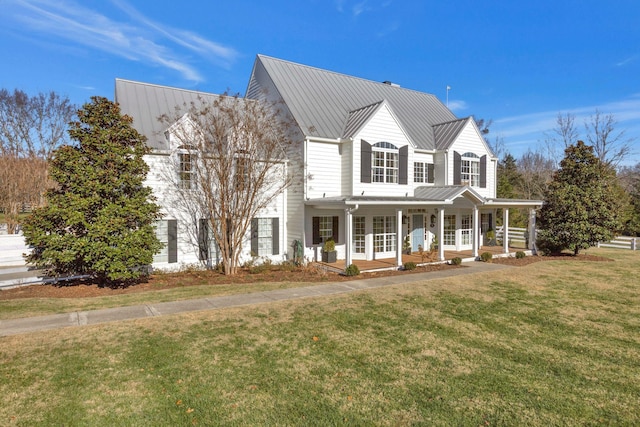 view of front of home featuring covered porch and a front lawn