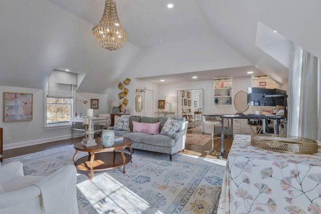 living room featuring an inviting chandelier, lofted ceiling, and hardwood / wood-style flooring