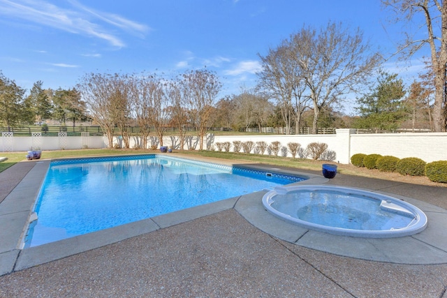 view of swimming pool featuring an in ground hot tub