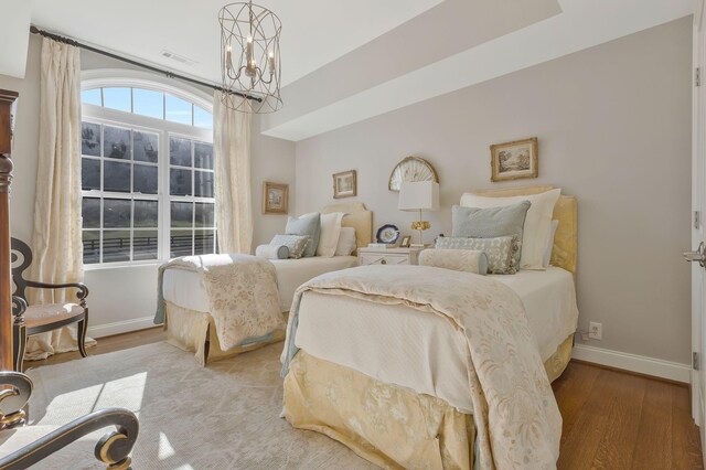 210 Green Rd, Franklin, TN 37069 - bedroom with a chandelier and wood finished floors