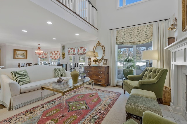 living room featuring a chandelier, a high ceiling, ornamental molding, and light tile patterned flooring