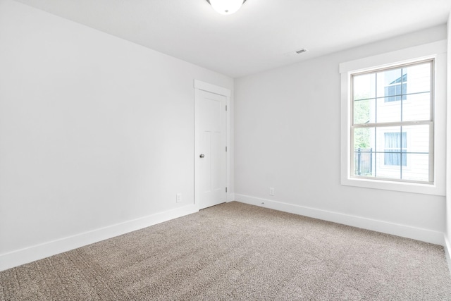 empty room featuring carpet flooring