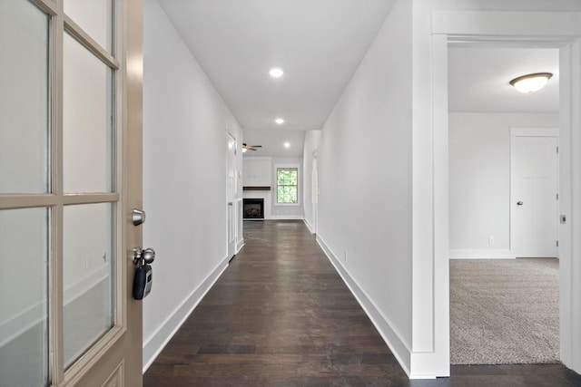 hallway featuring dark hardwood / wood-style flooring