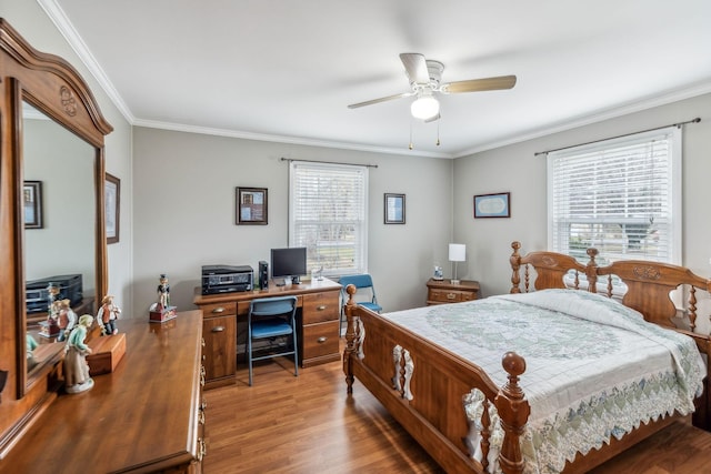 bedroom with wood-type flooring, ceiling fan, and ornamental molding