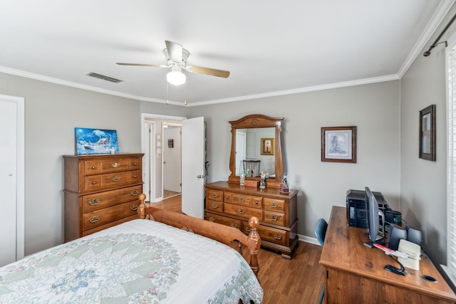 bedroom featuring ceiling fan, wood-type flooring, and ornamental molding