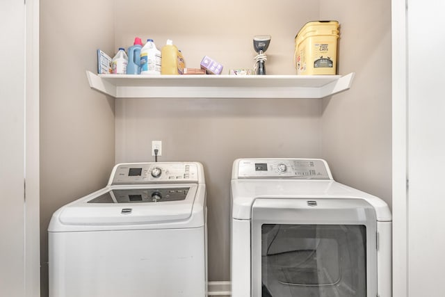 washroom featuring washing machine and dryer