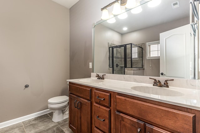 bathroom with tile patterned flooring, vanity, toilet, and an enclosed shower