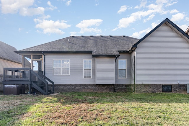 back of property featuring a sunroom and a yard