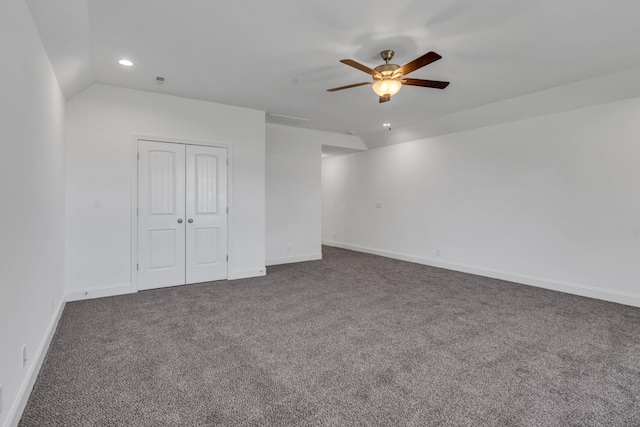 empty room featuring baseboards, dark carpet, a ceiling fan, and recessed lighting