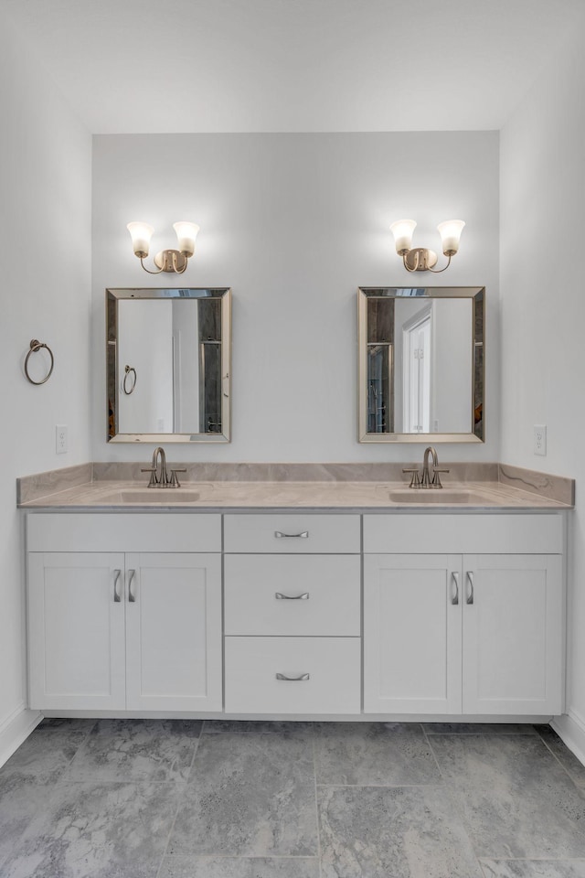 full bath featuring double vanity and a sink