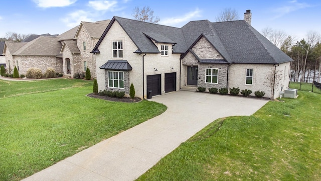 french country home with a front lawn and a garage