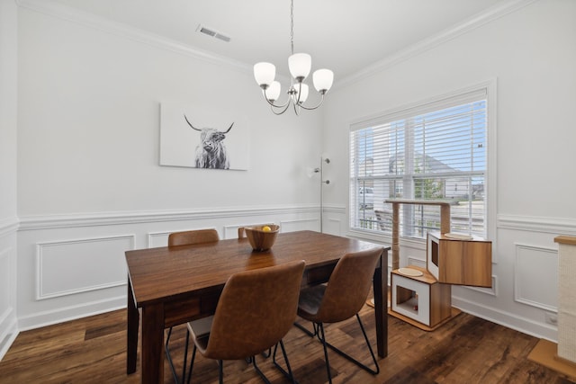 dining room with a notable chandelier, crown molding, and dark wood-type flooring