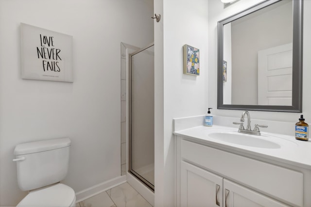 bathroom with toilet, vanity, and walk in shower