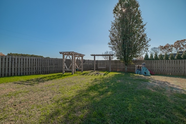 view of yard featuring a fenced backyard and a pergola